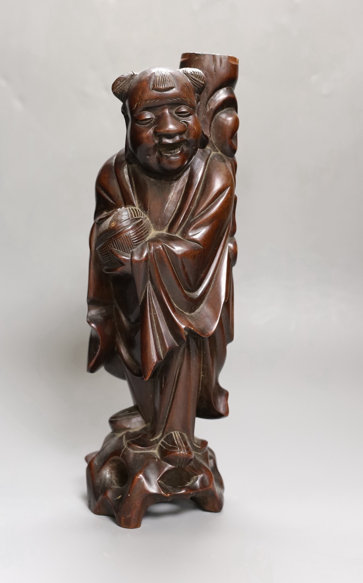 A Chinese hardwood figure of an immortal, 36cm